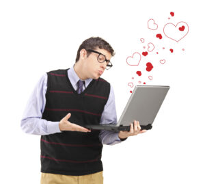 Man giving a kiss on a laptop and red heart shapes around